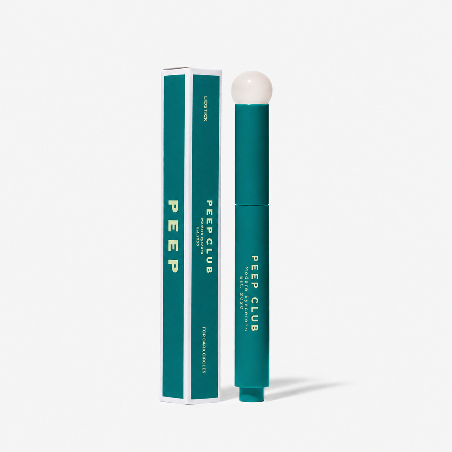 Dark Circle Correcting Lidstick™ balm stick with its box
